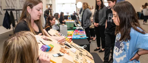 A child examines a sensory board 