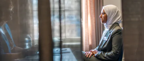A pharmacy student conducts a mock interview in Alumni Hall