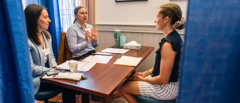 A Pharmacy student meets with prospective employers in a mock interview in Alumni Hall