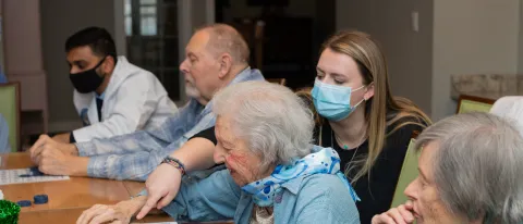 UNE health professions students play bingo with seniors at an assisted living facility