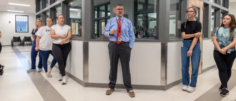 UNE students get a tour of the Maine Correctional Center's medical wing.