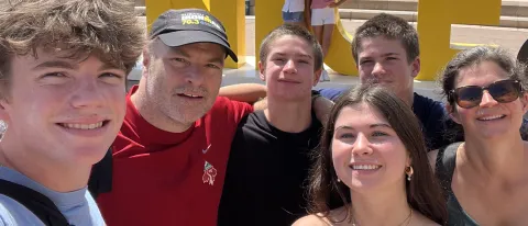 UNE's Norm O'Reilly poses with family in a plaza in Nice, France