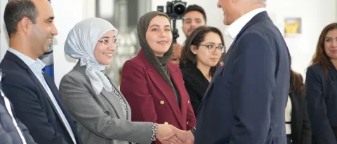 Ambassador Talwar greets a student