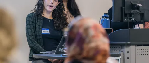 A group of students gives a slideshow presentation