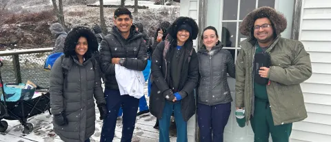 UNE students pose in the snow on Chebeague Island