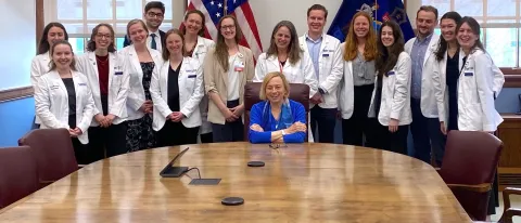 UNE medical students and administration pose with Maine Gov. Janet Mills