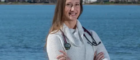Portrait of Bethany Miles posing in front of Portland's Back Cove