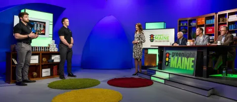 UNE alumni Joey Stanizzi and Dylan Schuett present their Underdog Performance product to a panel of judges in a TV studio