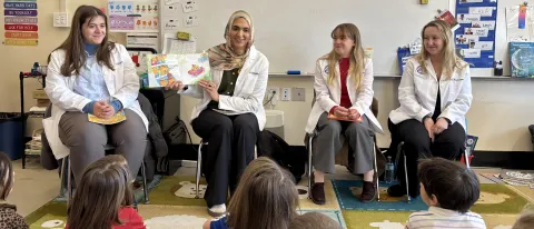 UNE students in health care professions read to local youth.