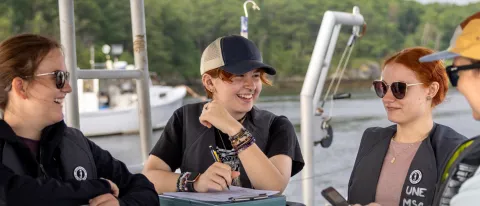 Kara Mickiewicz with her faculty advisor and other students