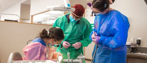 UNE dentistry and dental hygiene students provide oral health care for a pediatric patient