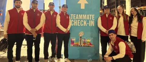 UNE business students pose in front of Levi's Stadium at Super Bowl LX
