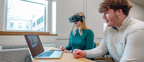 Students use a VR headset for a classroom activity