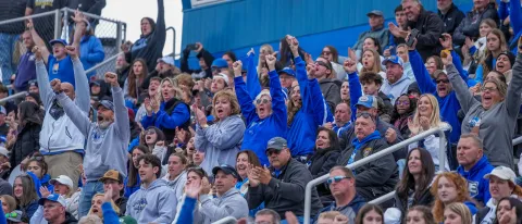 Fans cheer on UNE football in the stands