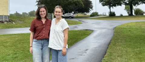 UNE student and mentor pose for outdoor photo