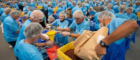 UNE community volunteers pack a record 200,000 meal kits to combat hunger across Maine