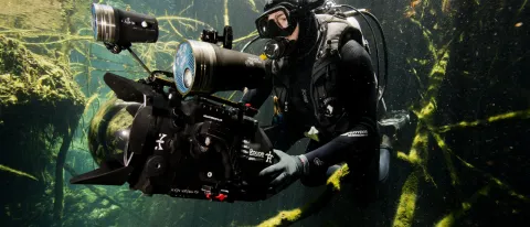 Underwater photo of cinematographer holding camera