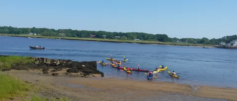 Students in UNE's Early College Program kayak in the Saco River.