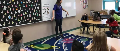 Student Kaylee Townsend discusses similarities and differences in comparative brain anatomy with children in Biddeford