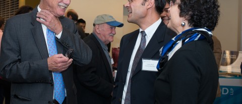 Senator Angus King talks with Dean Jeanne Hey and Associate Dean Charles Tilburg