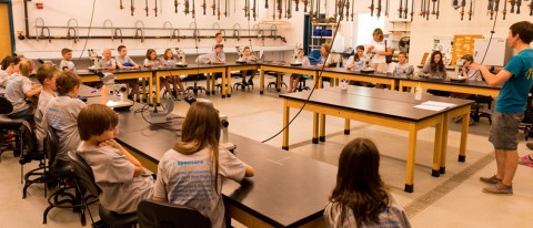 RSU 21 students are led in a lab activity at last year's Julia Robinson Math Festival, held on UNE's Biddeford Campus.