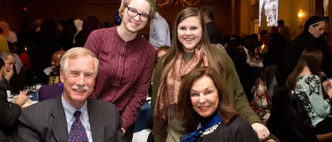 Senator Angus KIng and UNE President Danielle Ripich with students Halie Pruitt (left) and Sarah Schilke at the Maine NAACP's A