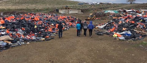 UNE students walk through the "lifejacket graveyard" on the Greek island of Lesbos