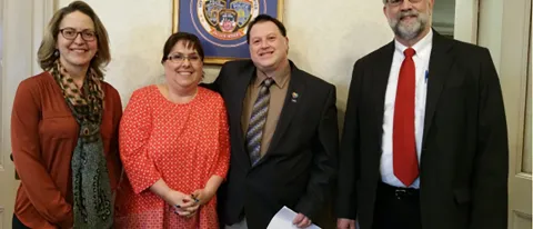 Caryn Husman, Cathy Dionne of the Autism Society of Maine, Councilor Robert Quattrone and Mayor Alan Casavant