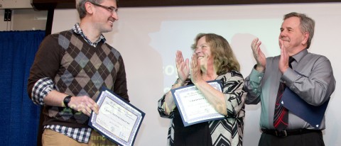 Craig Tennenhouse (left) receives the Excellence in Academic Advising Award for the College of Arts and Sciences, as Christine F