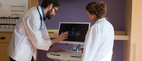 A UNE COM student and alum work together at Maine General Hosptial