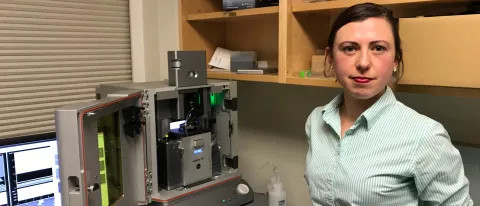 Eve Rose Balog with the state-of-the-art Atomic Force Microscope