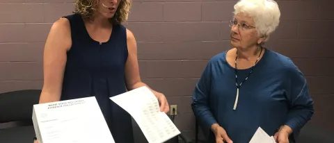 Emily Hilton and Polly Campbell display the sexual assault kit nurse examiners use 