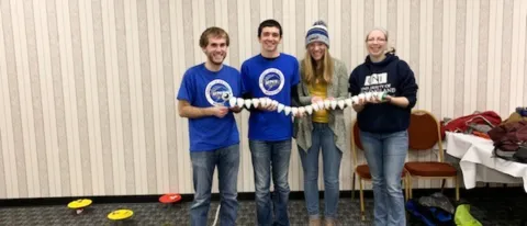 UNE Math Club members Shawn Pilling, Nick Paolini and Cassidy Smith with club advisor Jennifer Fatula