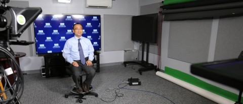 Takashi Kombayashi of the College of Dental Medicine sits in the ReadyCam studio