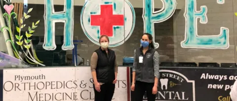 Brittania McDonald, UNE PA class of 2006, chief of medicine at Speare Memorial Hospital with COM student Kara Button