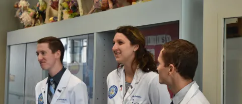 First-year UNE COM students Matt Postolowski, Kaitlyn De Stefano and Carl Minnerath tour the Eslie J. Parquette School, a specia