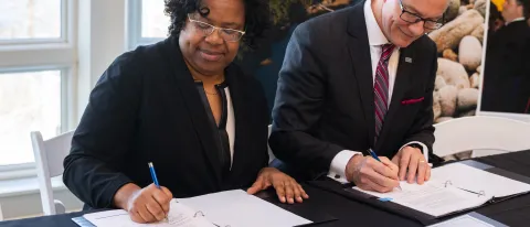 President Herbert and Dean Conway signed the agreement on January 30 at the Arthur P. Girard Marine Science Center