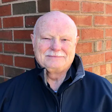 Headshot of U N E employee John Glass