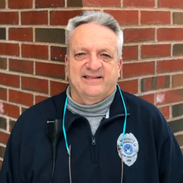 Headshot of U N E employee Eric Conrad