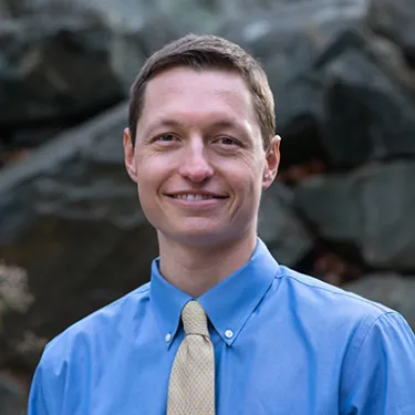 Headshot of U N E employee Christopher Tyson