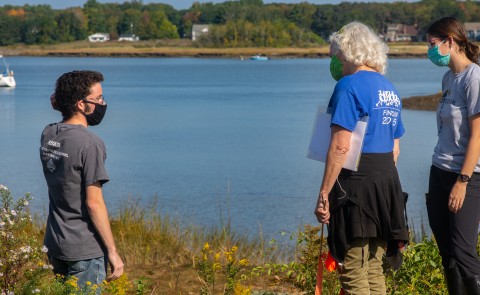Pam Morgan, center, and students on the shoreline in Biddeford.