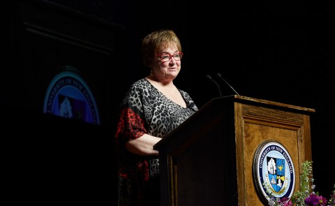 Image of woman standing at podium