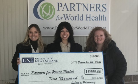 Pharmacy students with giant check