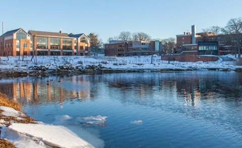 View of Biddeford Campus on the water and with snow