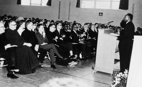 Martin Luther King, Jr. speaking to a crowd at St. Francis College