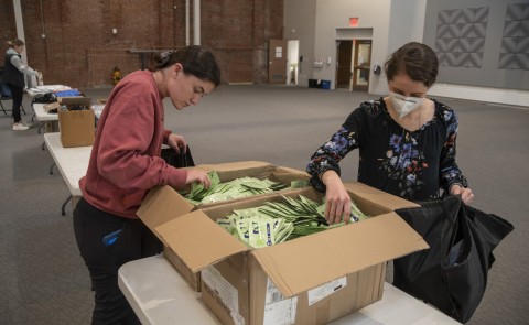Two students add fentanyl test strips to harm reduction bags