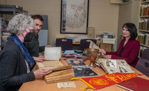 UNE archivists examine the Featherman collection