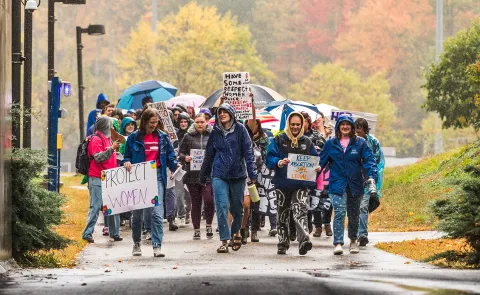 A group of students and faculty march through the UNE tunnel in support of women's reproductive rights