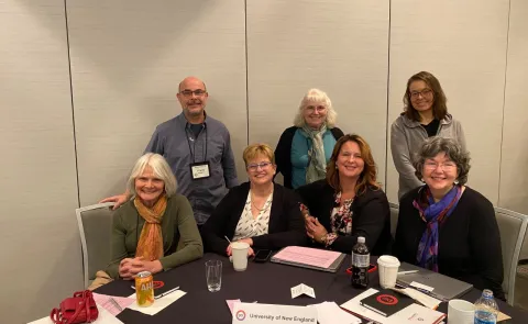 Faculty present on interprofessional education at a summit in Chicago