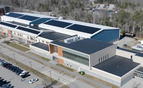Aerial image of solar panels atop the Harold Alfond Forum